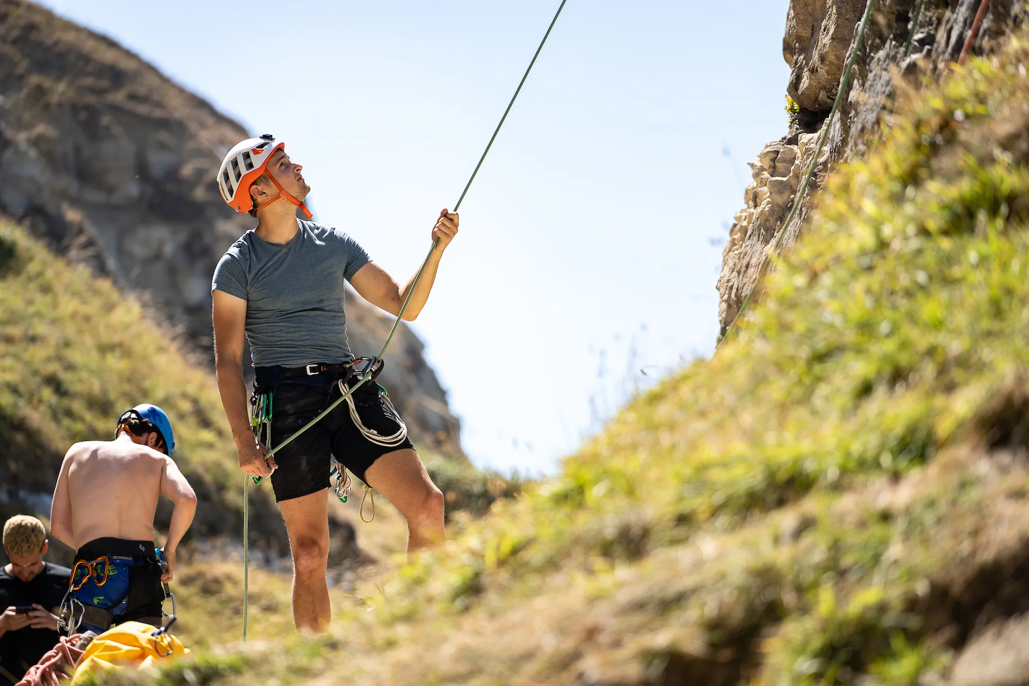 Hayden belaying from the bottom of the rock